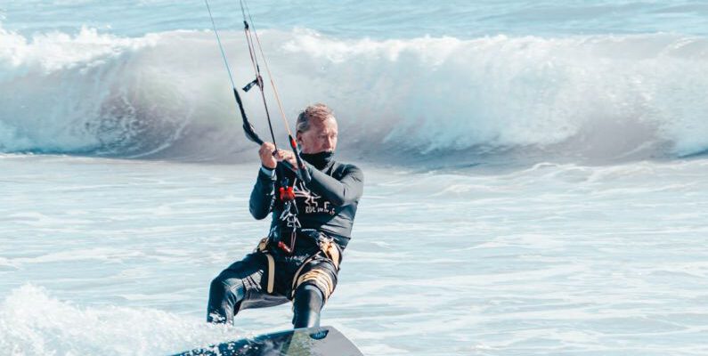 Calls-to-Action - A man kite surfing in the ocean