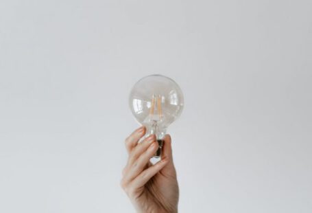 Innovation Inspiration - Anonymous female showing light bulb