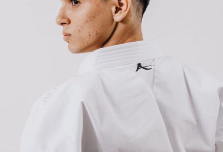 Strong Brand - A man in a white karate uniform