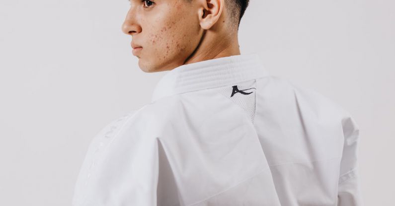 Strong Brand - A man in a white karate uniform