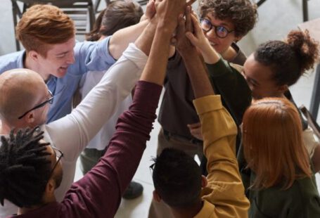 Company Culture - Photo Of People Holding Each Other's Hands